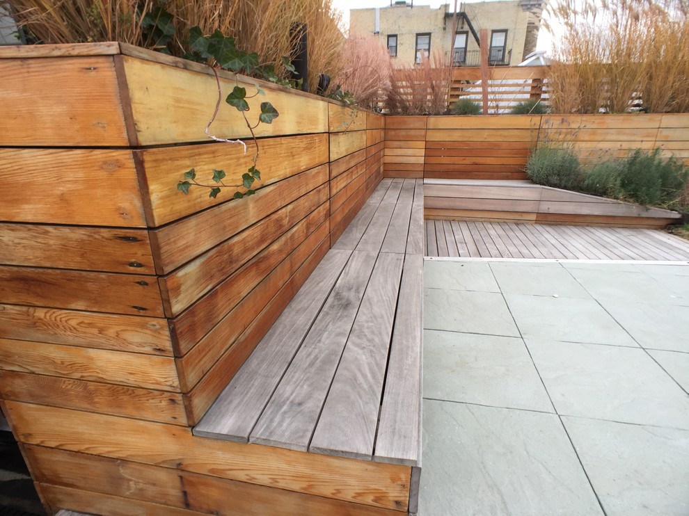 This is an example of a medium sized contemporary roof terrace in New York with no cover.