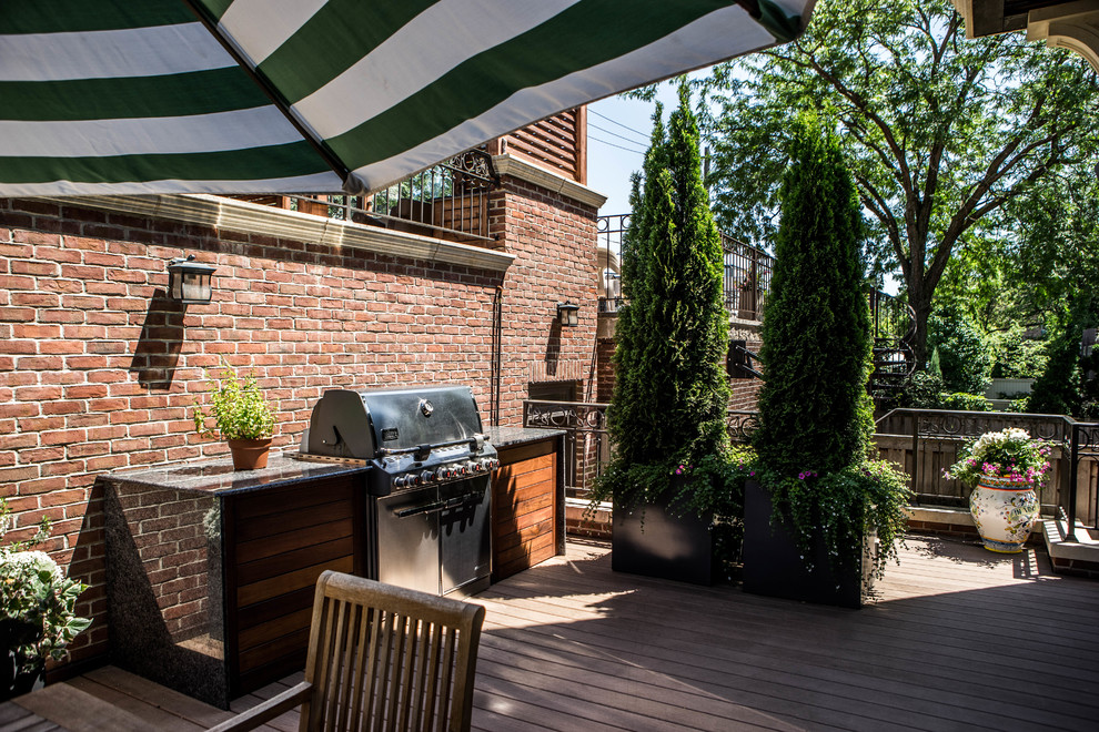 Inspiration for a mid-sized contemporary rooftop outdoor kitchen deck remodel in Chicago with a pergola