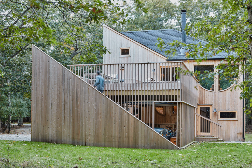 Inspiration for a midcentury side first floor wood railing terrace in New York with no cover.
