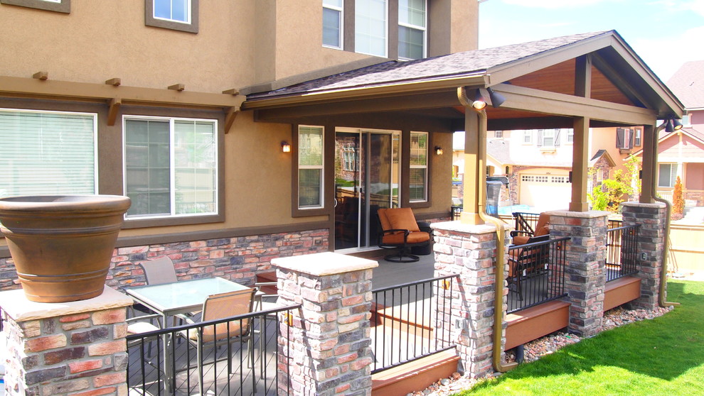 Inspiration for a small transitional side yard deck remodel in Denver with a pergola