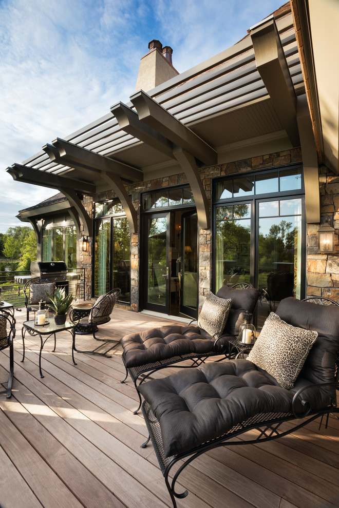 World-inspired back terrace in Minneapolis with a pergola.