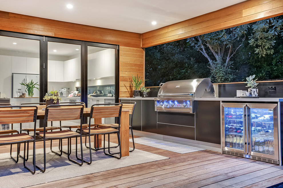 Outdoor kitchen deck - coastal outdoor kitchen deck idea in Melbourne with a roof extension