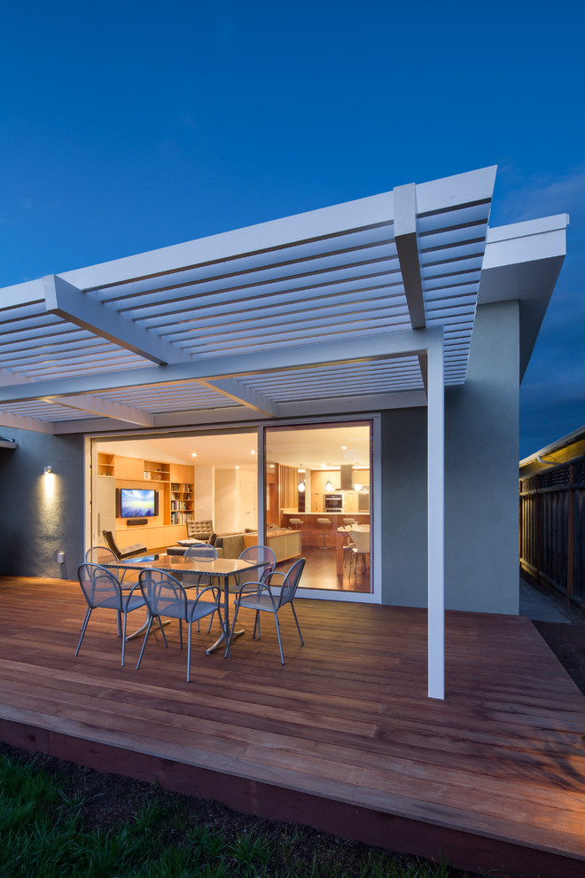 Example of a mid-sized 1960s backyard deck design in San Francisco with a pergola