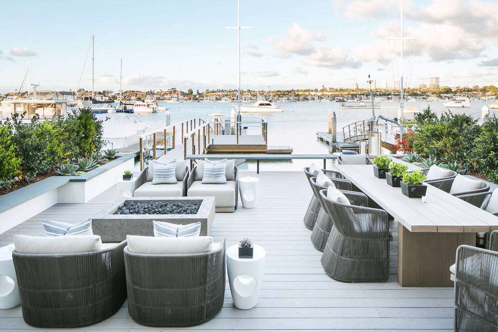 Design ideas for a nautical back terrace in Orange County with a dock and no cover.