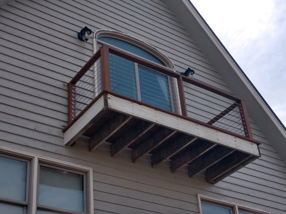 Small side yard deck photo in Charleston with a roof extension