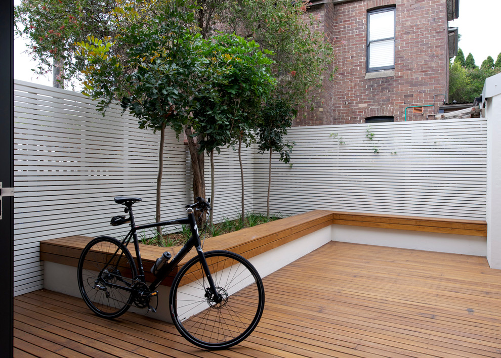 Contemporary back terrace in Sydney with no cover.