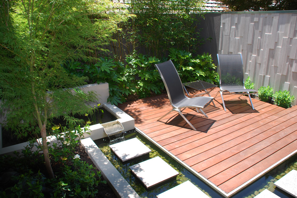 Mid-sized trendy backyard ground level privacy deck photo in Melbourne with no cover