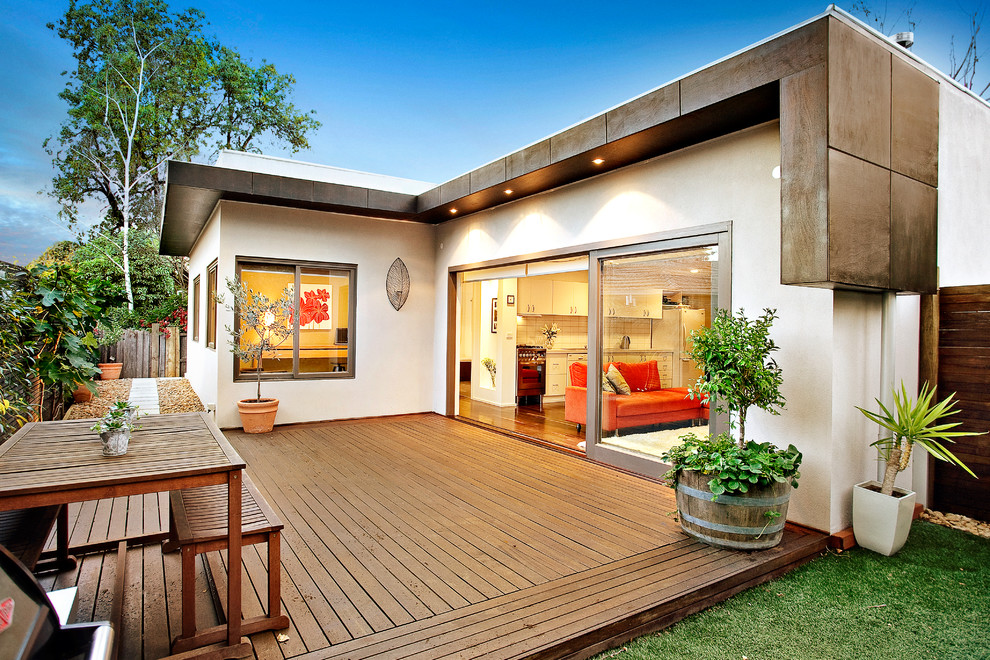 Inspiration for a mid-sized modern backyard deck remodel in Other