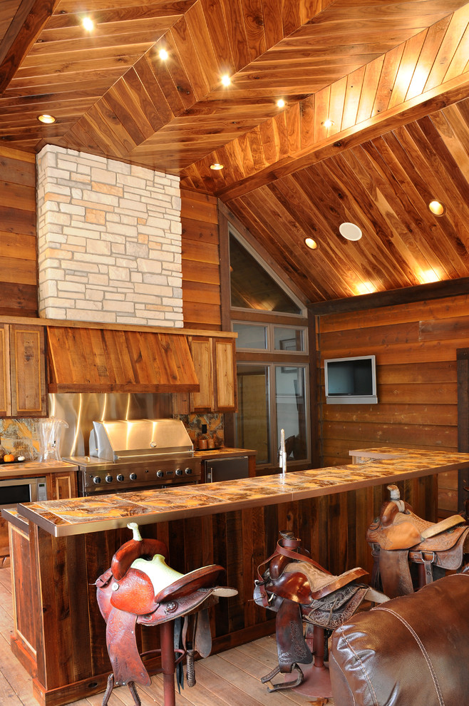 Outdoor kitchen deck - rustic outdoor kitchen deck idea in Other with a roof extension