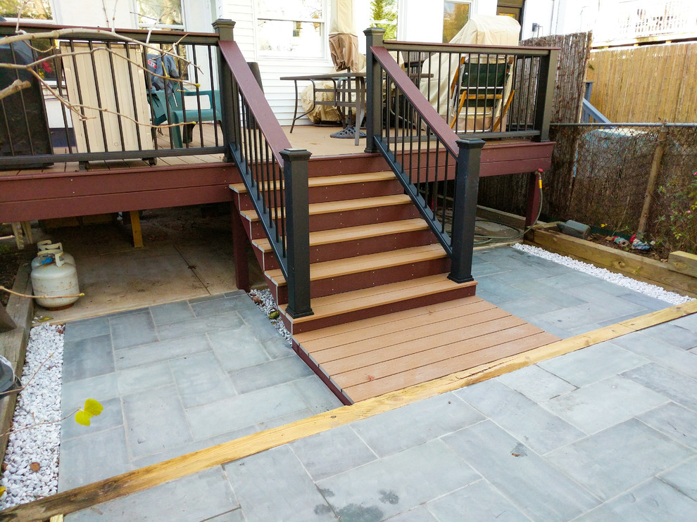 Inspiration for a mid-sized modern backyard deck remodel in New York with no cover