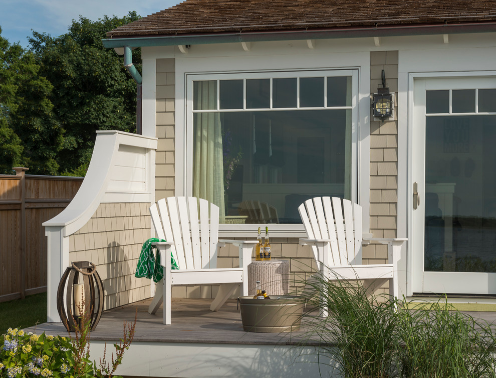 This is an example of a beach style back terrace in Providence with no cover.