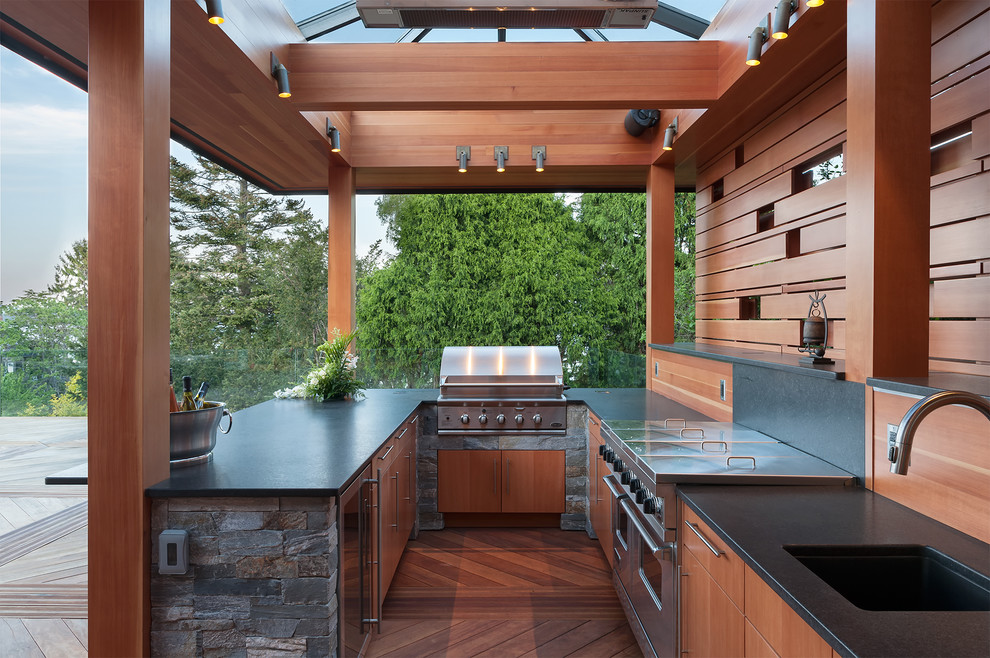 This is an example of a large contemporary terrace in Vancouver with an outdoor kitchen.