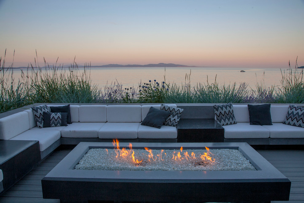 Deck - transitional backyard deck idea in Vancouver with a fire pit and no cover