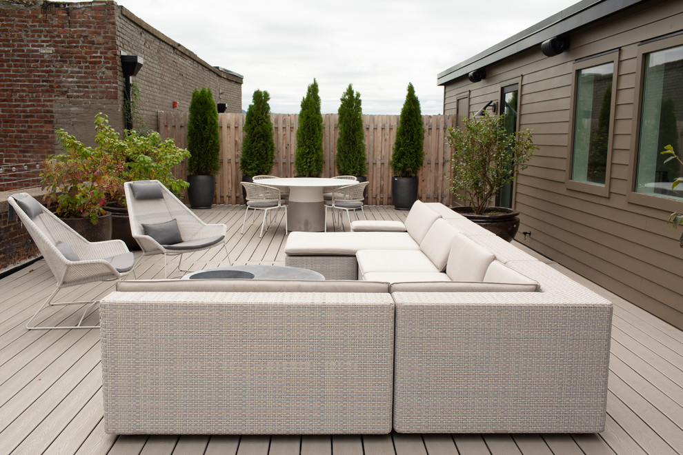 Inspiration for a large industrial rooftop deck remodel in New York with no cover