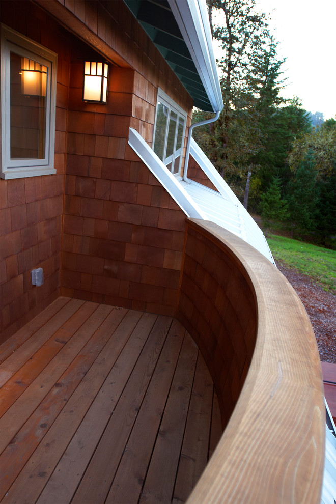 Inspiration for a small craftsman rooftop deck remodel in Other with a roof extension