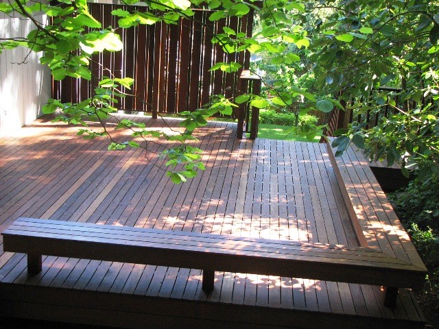 Deck - craftsman backyard deck idea in Seattle with a pergola