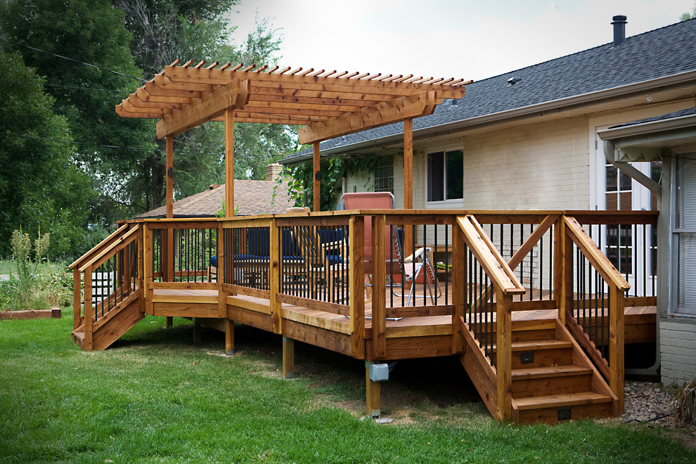 Design ideas for a medium sized classic back terrace in Denver with a pergola.