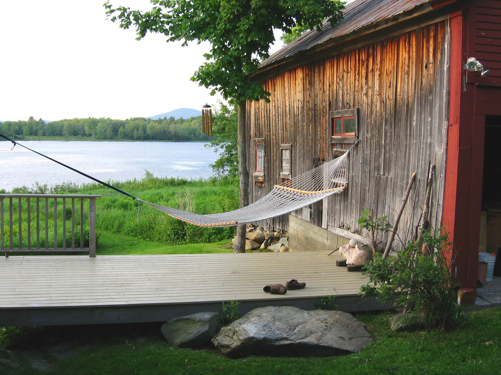 Example of a farmhouse deck design in Portland Maine with no cover