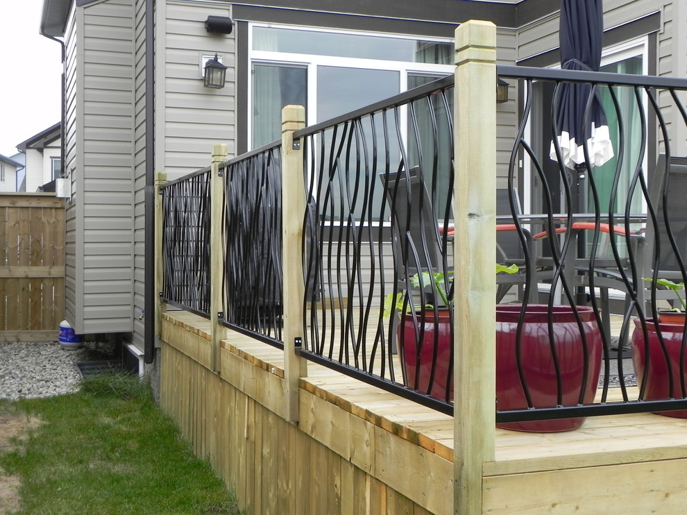 BENT railing design on a custom outdoor deck Modern Deck Calgary