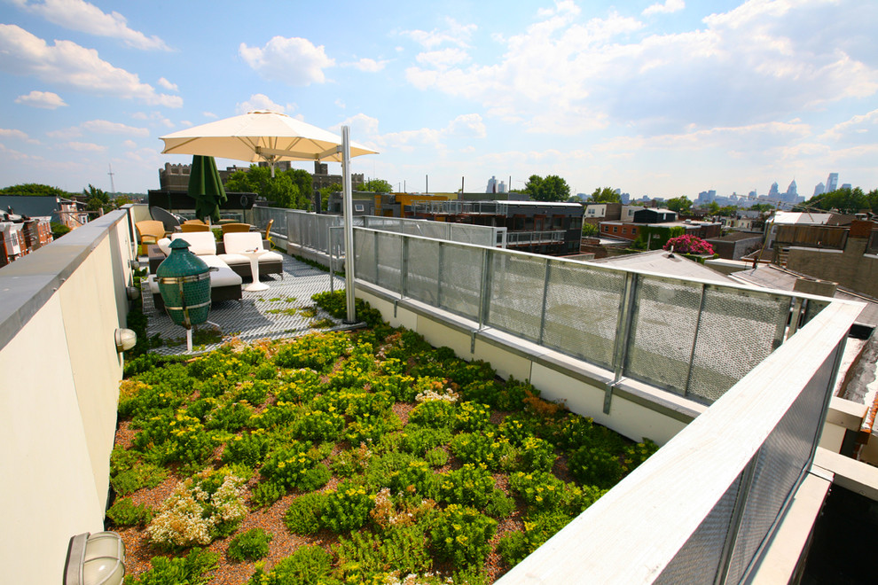 Immagine di una terrazza industriale di medie dimensioni e sul tetto con nessuna copertura