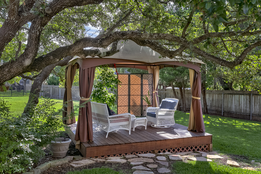 Elegant backyard deck photo in Austin