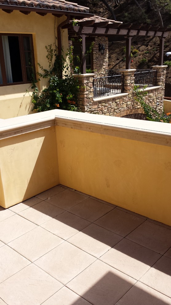 This is an example of a small mediterranean roof terrace in Los Angeles with no cover.