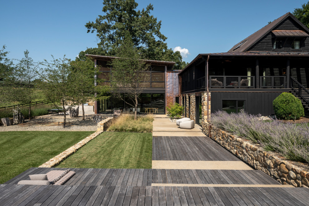 Réalisation d'une terrasse au rez-de-chaussée design avec aucune couverture.