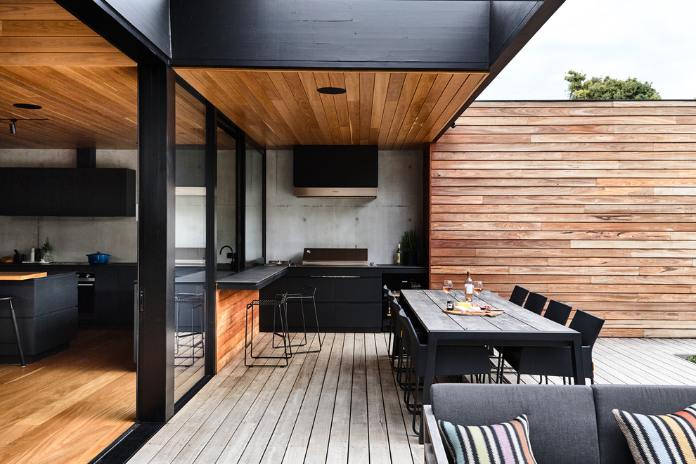 Deck - mid-sized contemporary backyard deck idea in Melbourne with a roof extension