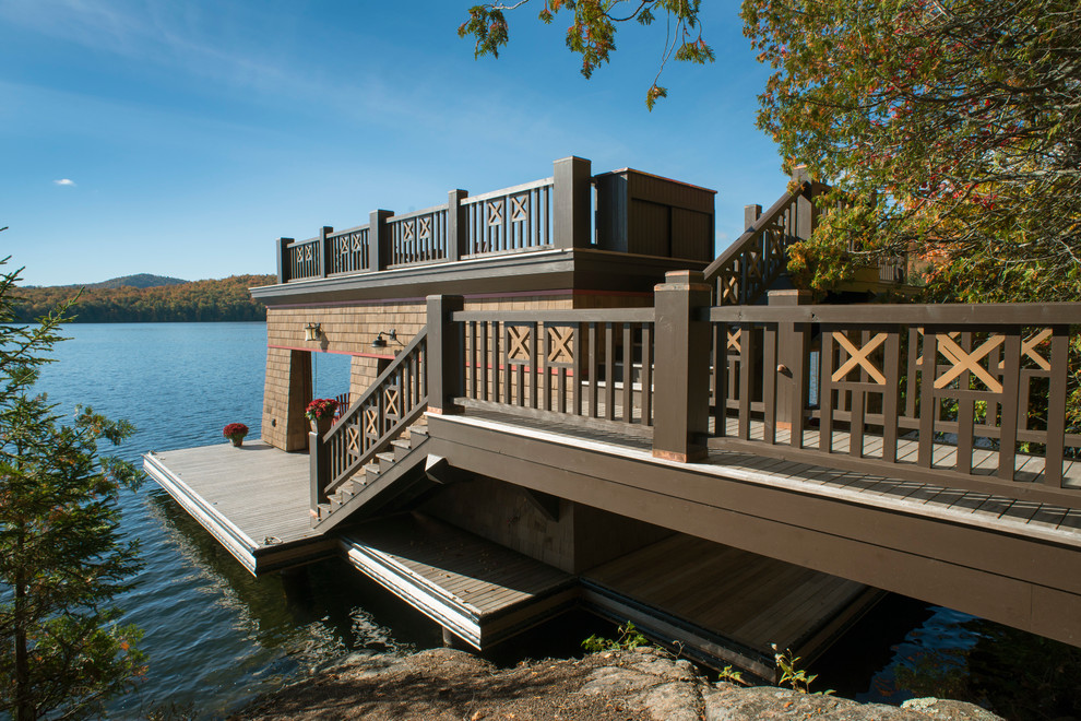 Design ideas for a large rustic back terrace in New York with a dock and no cover.