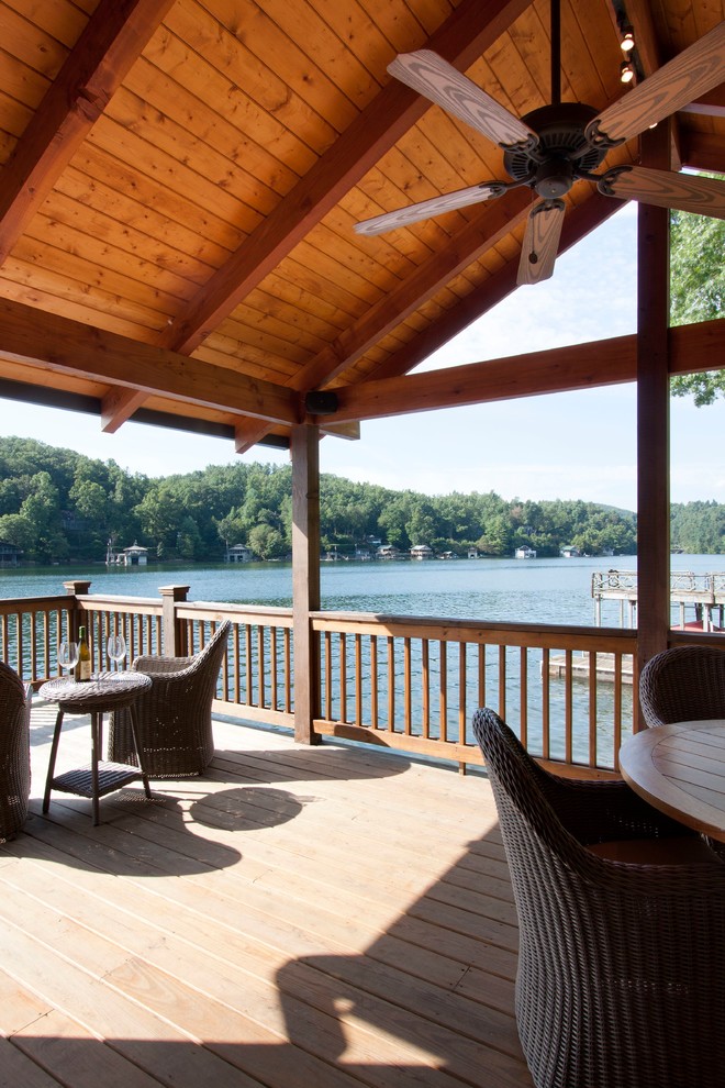 Inspiration for a mid-sized timeless side yard dock remodel in Other with a roof extension