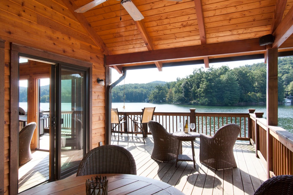 Mid-sized elegant side yard dock photo in Other with a roof extension