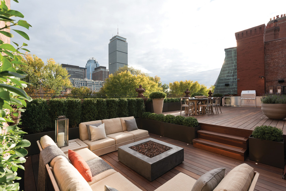 This is an example of an expansive classic roof rooftop terrace in Boston with an outdoor kitchen and no cover.