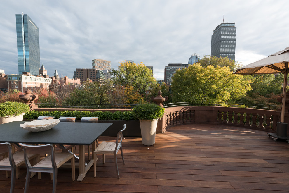 This is an example of an expansive traditional roof terrace in Boston with no cover.