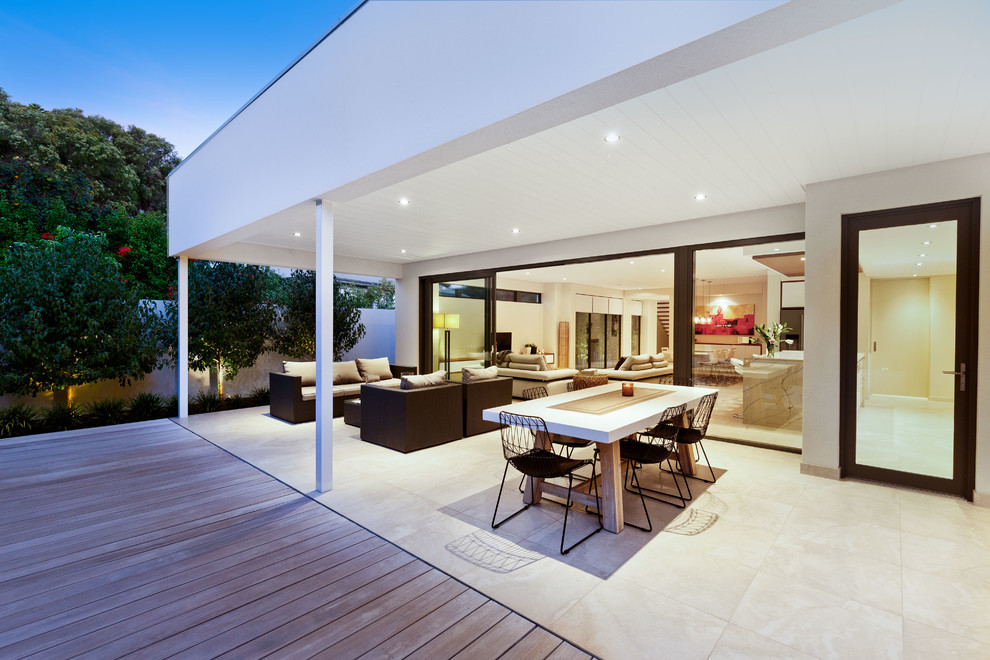 Design ideas for a large contemporary back terrace in Perth with a potted garden and a roof extension.