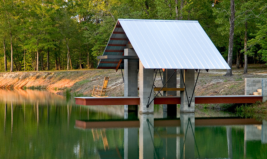 This is an example of a large industrial back terrace in Atlanta with a dock.