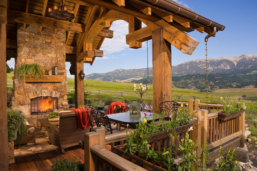 Inspiration for a rustic terrace in Other with a fire feature.