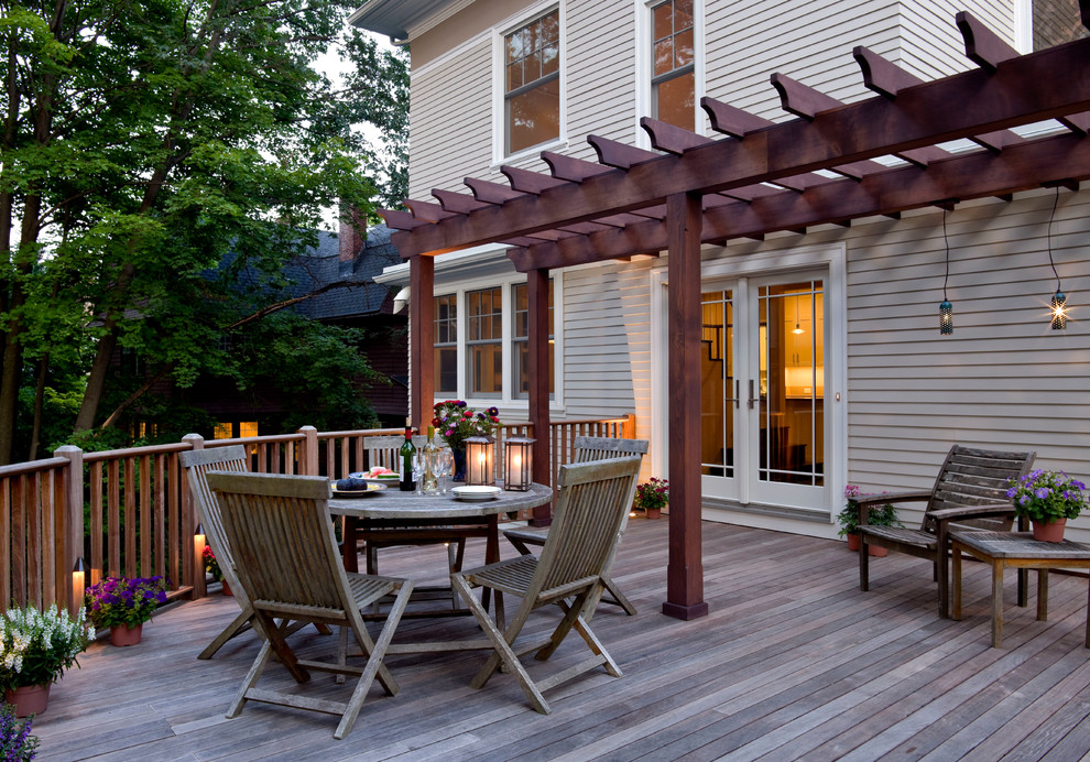 Inspiration for a mid-sized timeless backyard deck remodel in Boston with a pergola