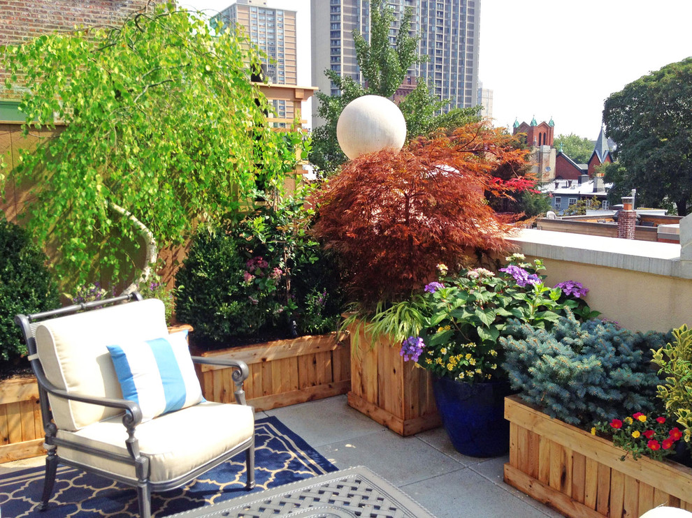 Elegant rooftop deck container garden photo in New York