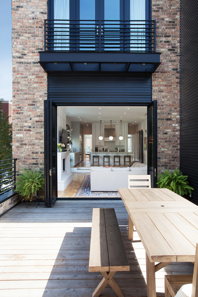 Mid-sized minimalist rooftop deck photo in Chicago with a roof extension