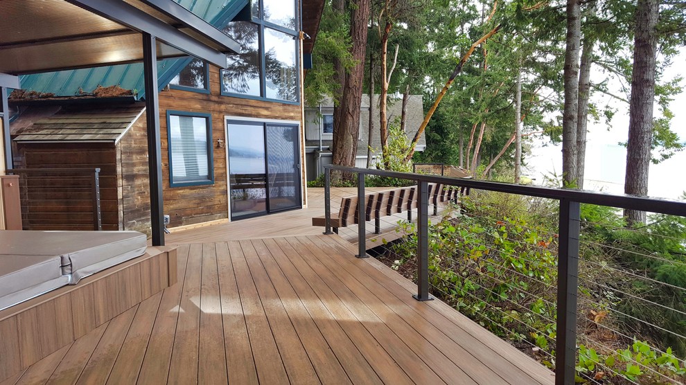 Inspiration for a mid-sized coastal backyard deck remodel in Seattle with no cover