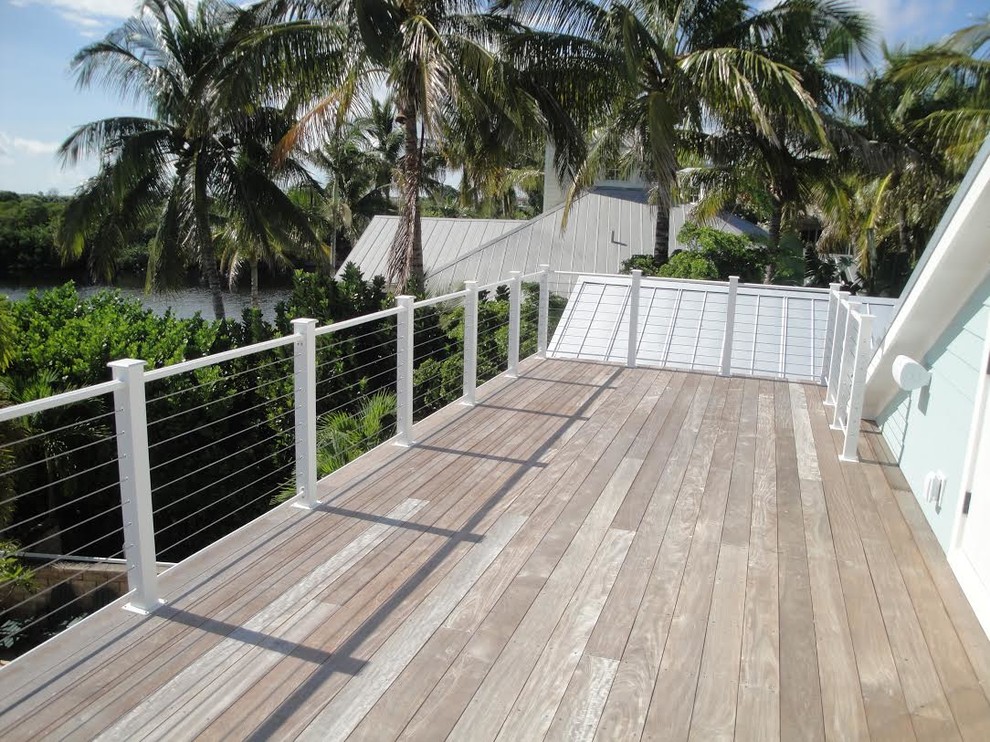 This is an example of a medium sized nautical roof terrace in Tampa with no cover.