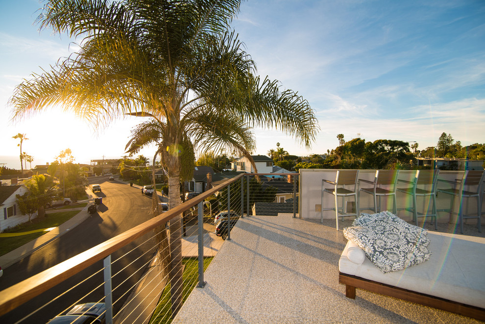 Mid-sized minimalist rooftop deck photo in San Diego with a fire pit and a pergola