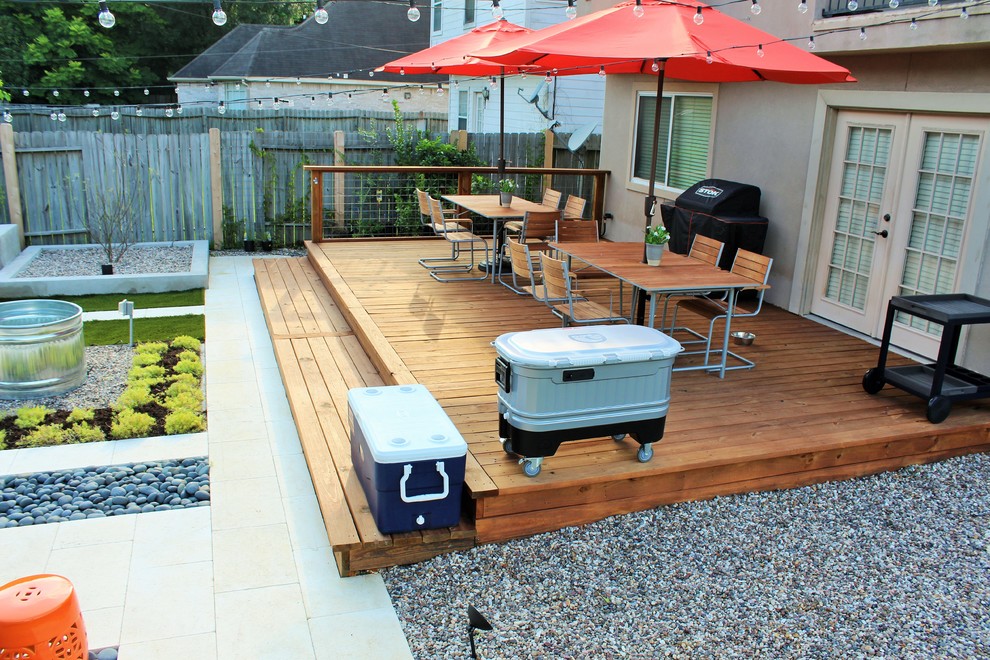 Inspiration for a medium sized modern back terrace in Houston with a fire feature and no cover.