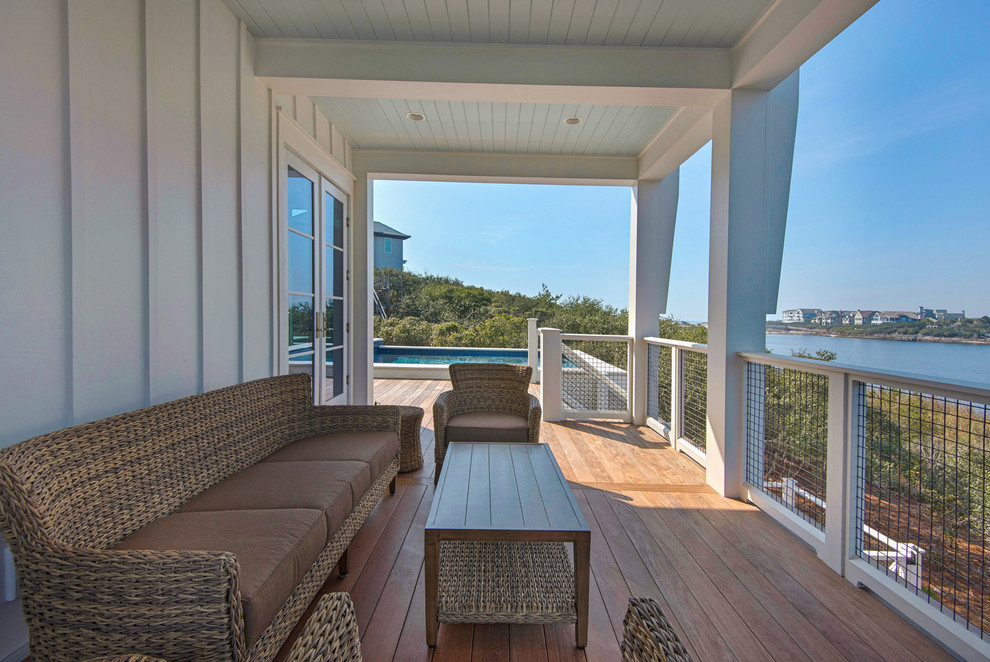 Design ideas for a medium sized nautical side terrace in Miami with a roof extension.
