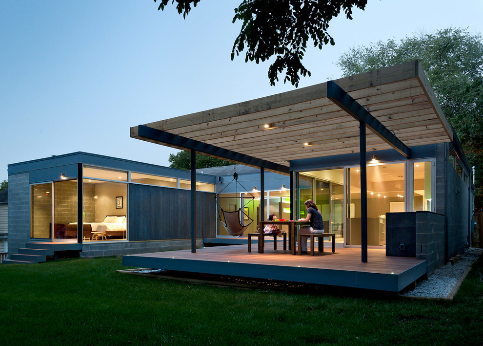 Réalisation d'une terrasse minimaliste avec une pergola.