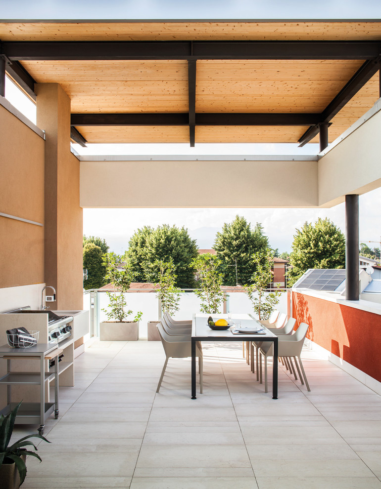 Inspiration for a large contemporary rooftop rooftop deck remodel in Venice with a pergola
