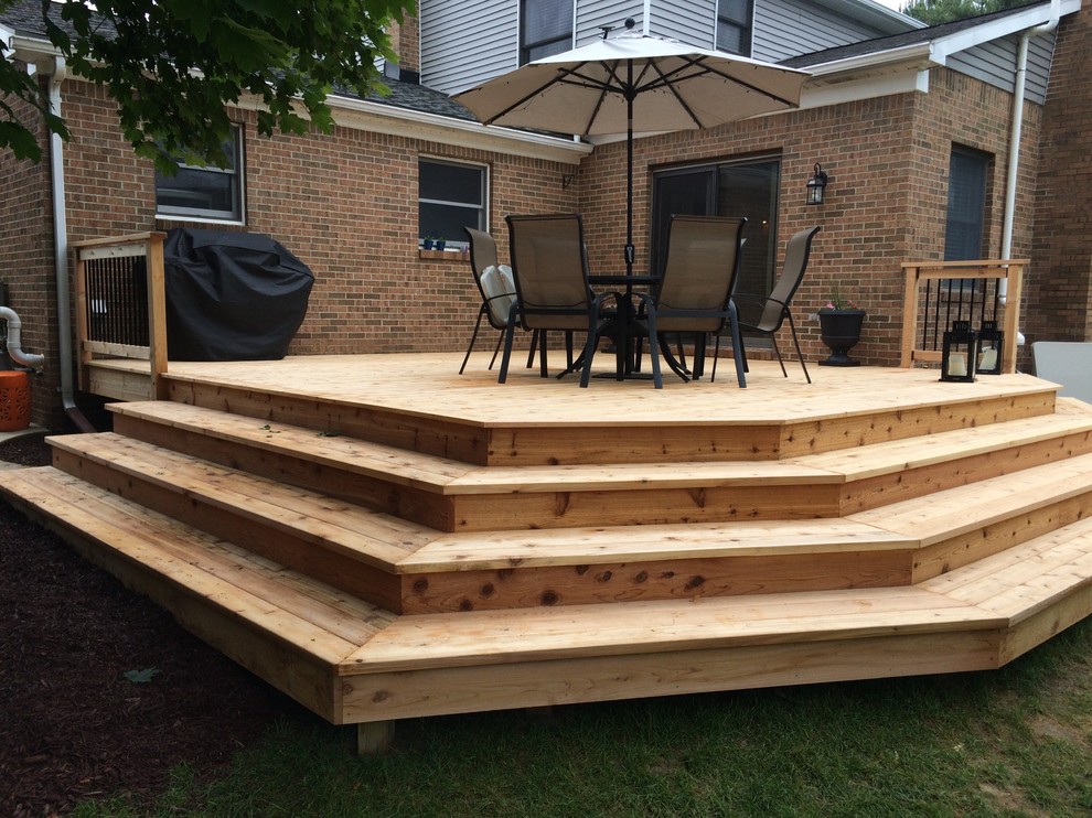 Example of a mid-sized arts and crafts backyard outdoor kitchen deck design in Detroit with no cover