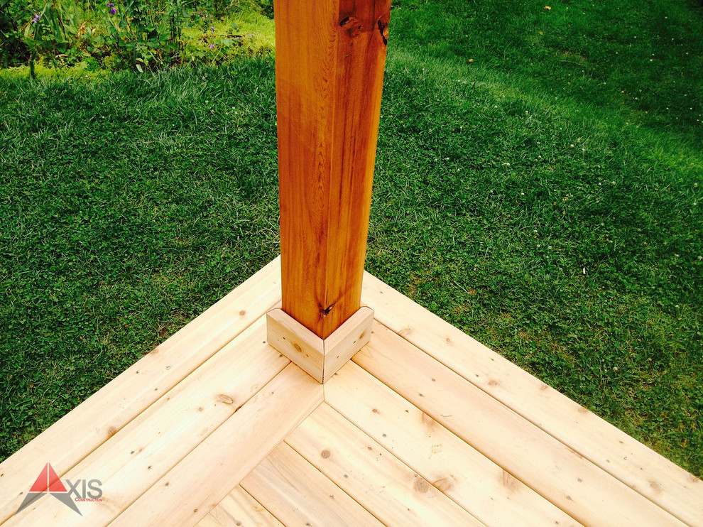 Huge elegant backyard deck photo in Toronto with a pergola