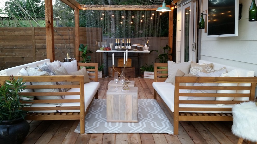 Design ideas for a small shabby-chic style back terrace in Austin with a pergola.