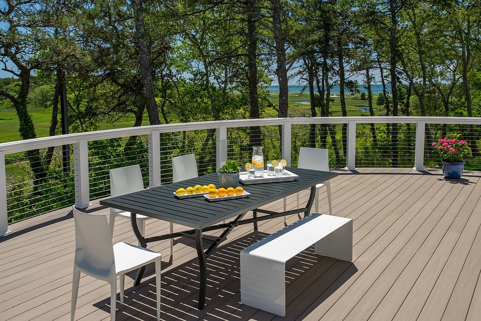 Inspiration for a large coastal backyard deck remodel in Boston with no cover